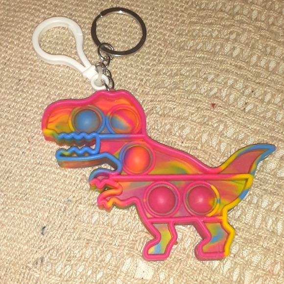 POPPERS TYRANNOSAURUS REX KEYCHAIN CHARM NRMINT CONDITION - Picture 1 of 3